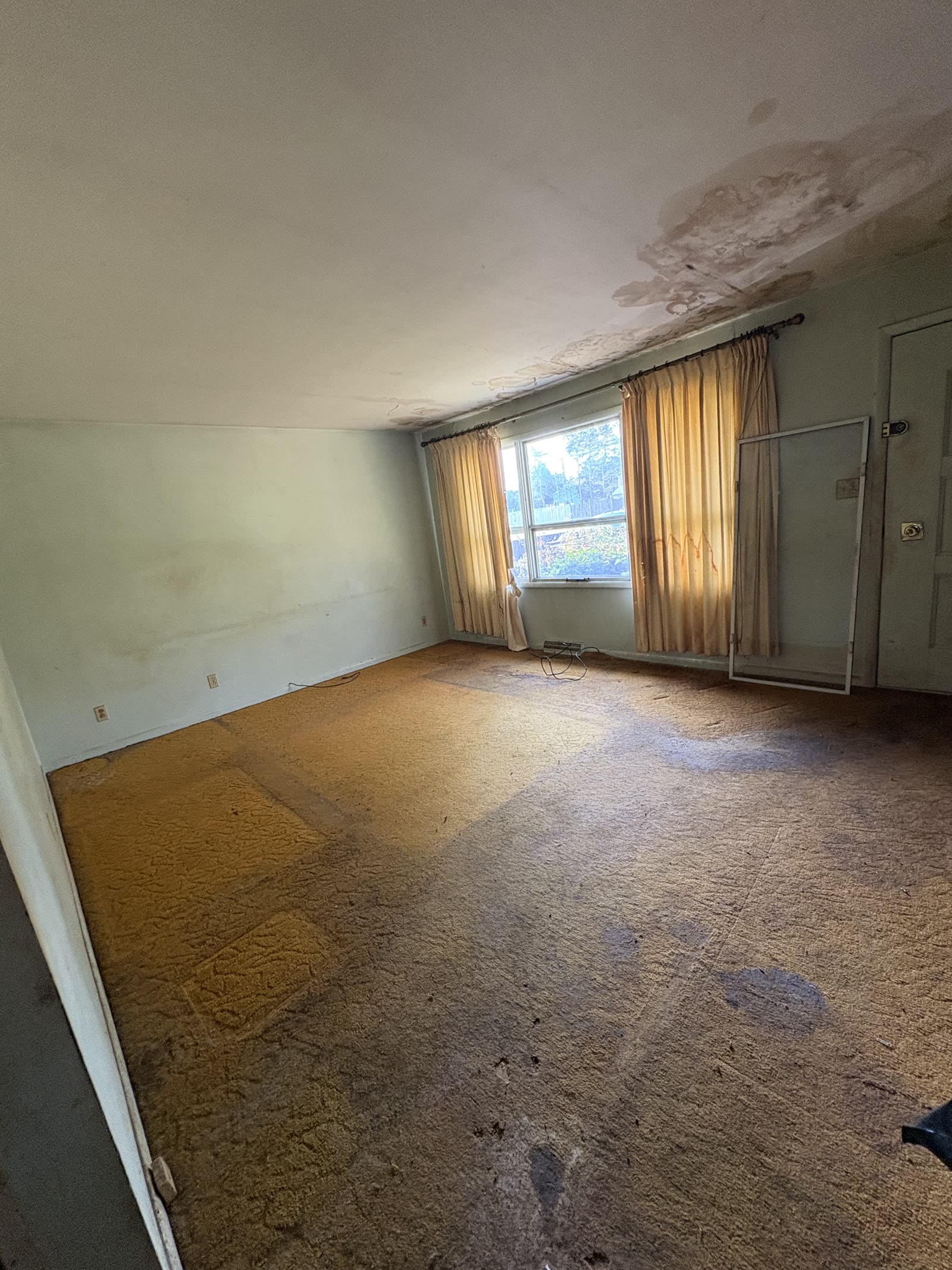 Living room before improvements in a Capital Region home.